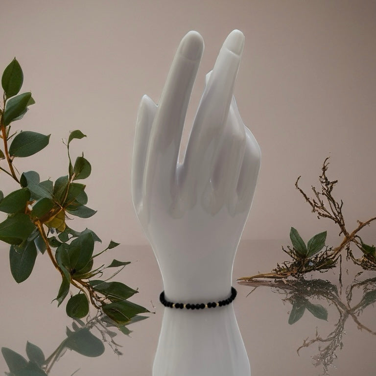 Black Onyx Bracelet with 18K Gold stones