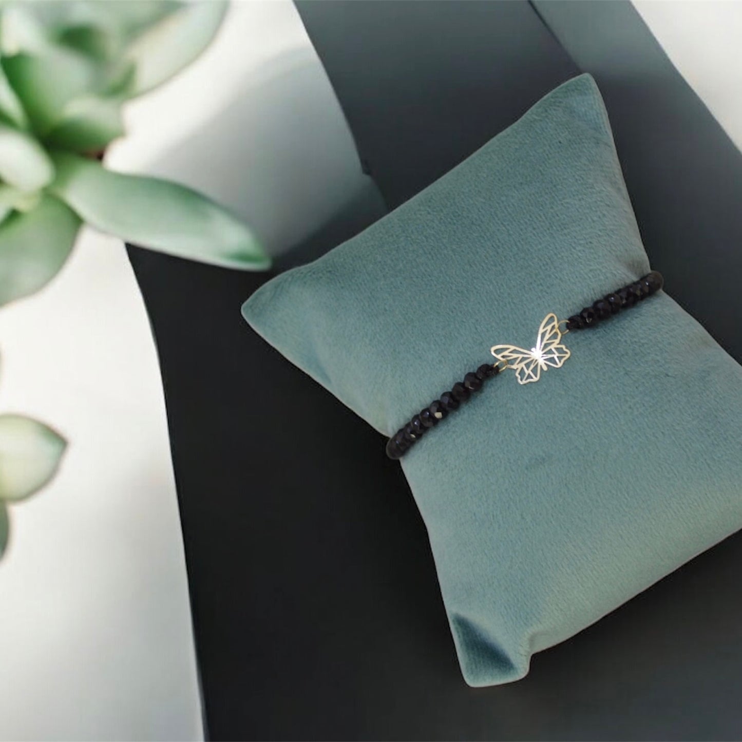 Black Onyx Bracelet with 18K Butterfly Motif